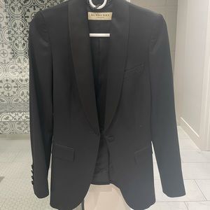 Black blazer with satin buttons in perfect condition.